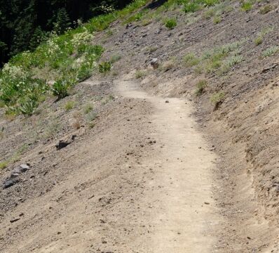 Crossing exposed volcanic sand slope just before the volcanic plug Barker Pass