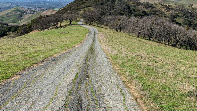 Heading back down the ridge on the paved road on the Black Diamond trail Black Diamond Trail