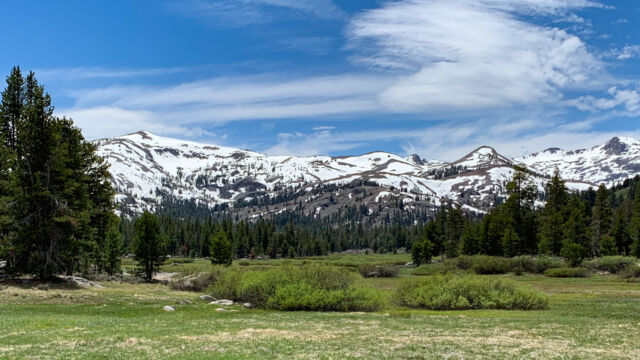 Snow-capped mountains around the meadow in Charity Valley Snow-capped mountains around the meadow in Charity Valley